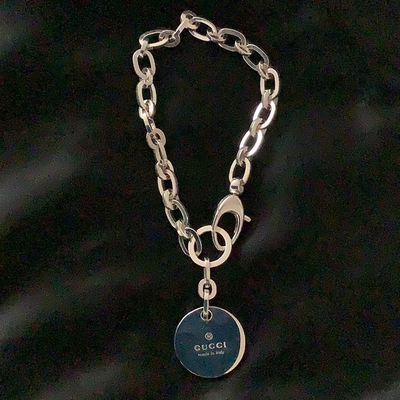 Authentic Gucci sterling silver bracelet with Gucci charm. New